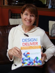 Loui Lord Nelson poses with her UDL book, Design and Deliver
