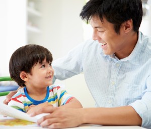 Father Helping Son With Homework