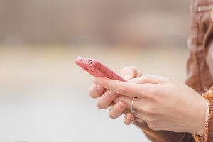 girl texting on iphone