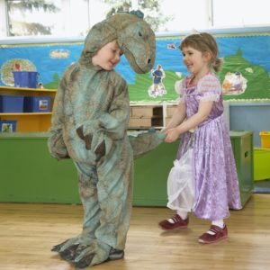 preschool students in costume dinosaur princess play time