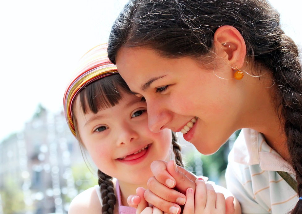 girl and mom smiling